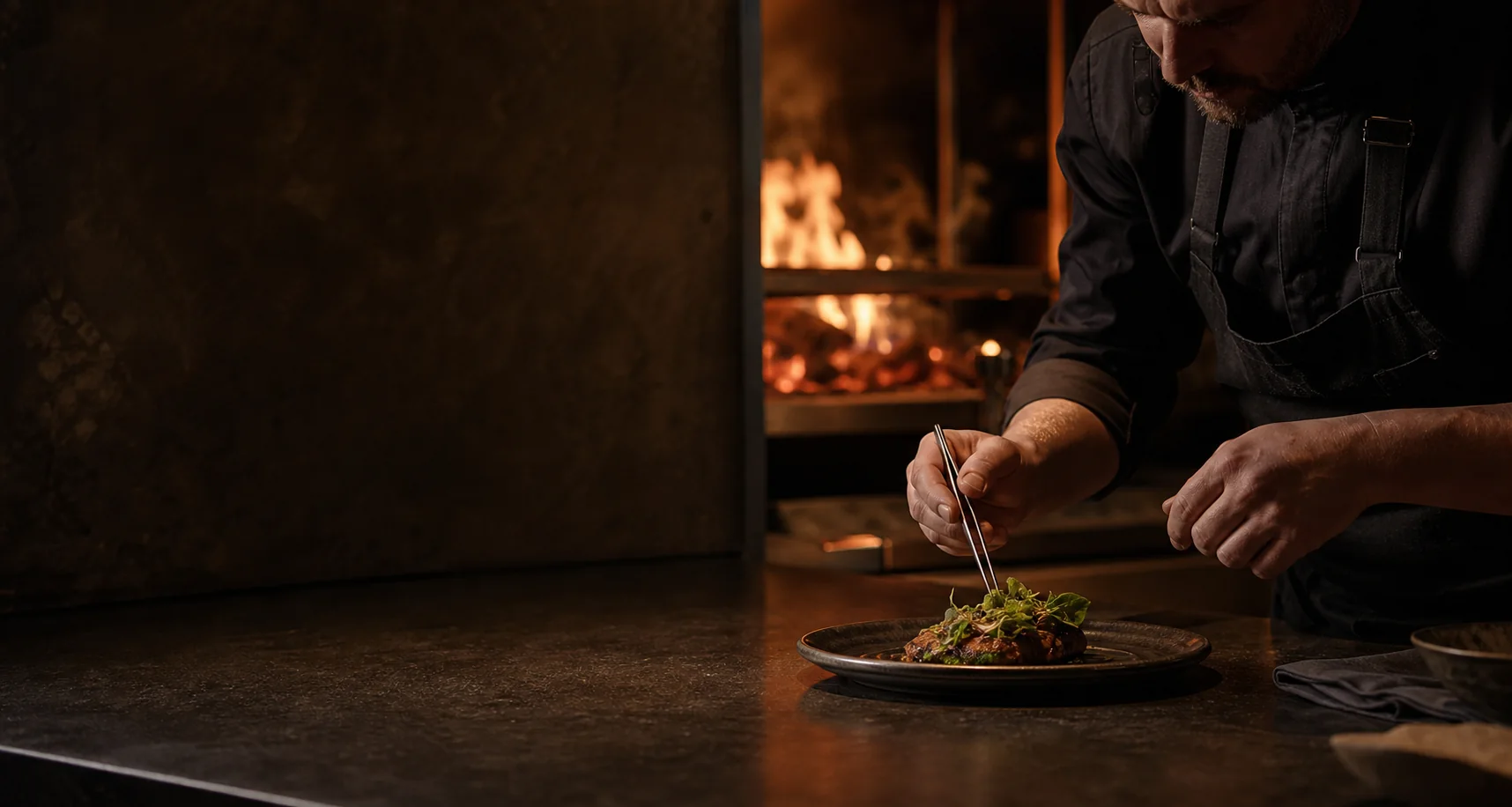 Chef plating a fictional seasonal dish beside a wood fire